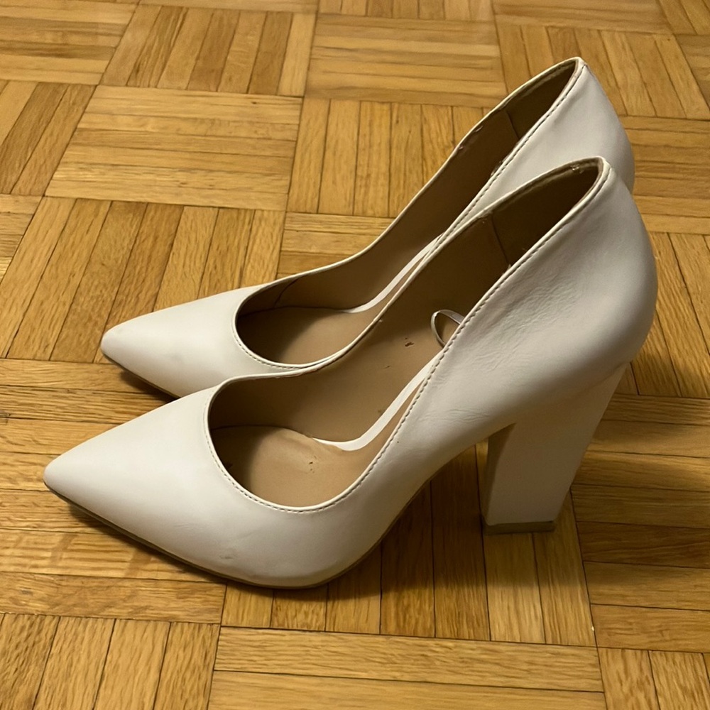 White faux leather pumps